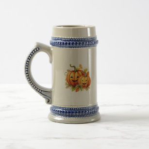 Two pumpkins carved with smiley faces beer stein