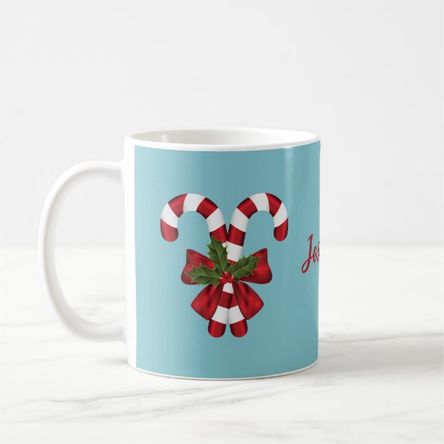 Two Red And White Candy Canes On Blue With Name Coffee Mug (Left)