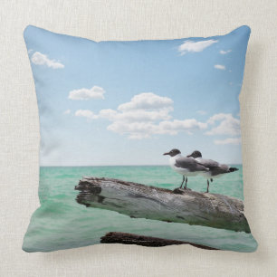 Two seagulls sitting on a dead tree sticking out throw pillow