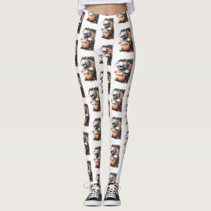Two skulls and a pumpkin among flowers. leggings