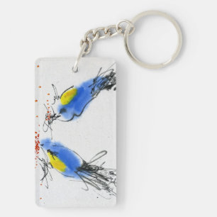 Two small titmouses pecking grain. Calligraphy Keychain