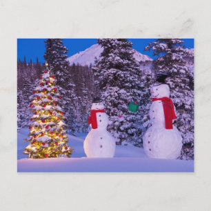 Two Snowmen Exchange Gifts by the Tree Holiday Postcard