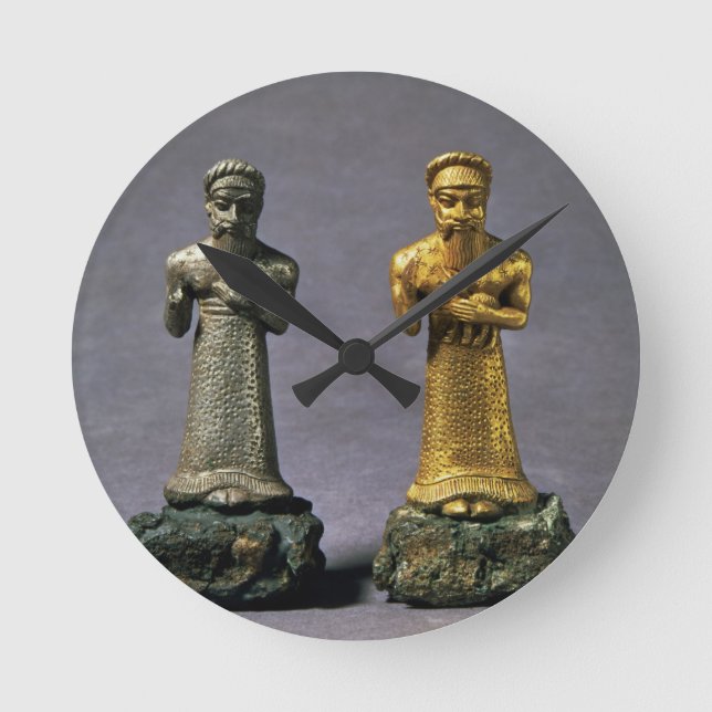 Two statuettes of men carrying offerings of goats, round clock (Front)