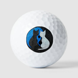 Two stylized cats golf balls