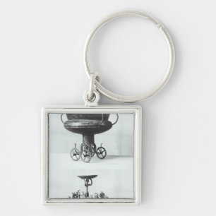 Two votive chariots for collecting rainwater keychain