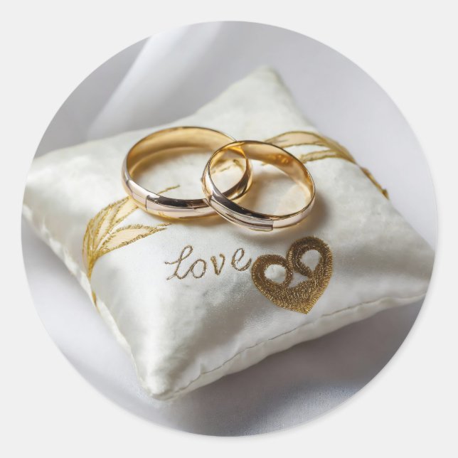 Two wedding rings on a white pillow  classic round sticker (Front)