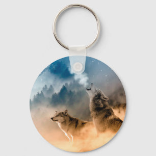 Two wolves howl at the full moon in forest keychain