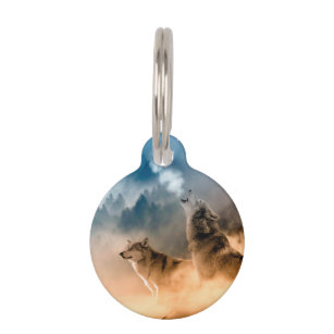 Two wolves howl at the full moon in forest pet tag