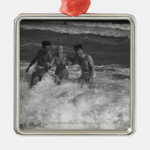 Two young men and woman playing in wave B&W Metal Ornament