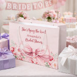 Tying the knot pink bow floral Bridal Shower Large Gift Bag<br><div class="desc">Blush pink background decorated with a pink coloured bow and pink roses,  flowers. Personalize and add a name
Text: She's tying the knot</div>
