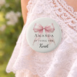 Tying the knot pink bow ivory pearls Bachelorette 2 Inch Round Button<br><div class="desc">Celebrate your special milestone with this chic bachelorette party button. The design features a luxurious pink bow adorned with delicate pearl strands. It serves as a stylish accessory for the bride-to-be to wear during her bridal shower or night out with bridesmaids. Ivory background color.</div>