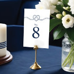 Tying The Knot Rope Heart Nautical White & Navy Table Number<br><div class="desc">Tying the knot? our minimal & elegant navy and white nautical wedding table number is perfect for an ocean-themed nautical wedding. The design features our hand-drawn heart-shaped rope knot illustration, with the table number designed in a clean, minimal layout. The sharp white and deep navy colours create a modern nautical...</div>