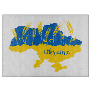 Ukraine typography and wheat ear on Ukrainian flag Cutting Board