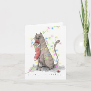 un chaton dans une carte de Noël pleine