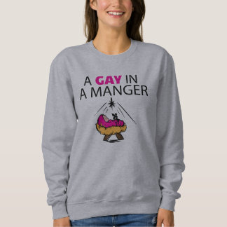Un homosexuel dans un sweatshirt de Noël de Manger