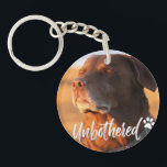 Unbothered Golden Hour Dog – Premium Minimalist  Keychain<br><div class="desc">Capture the ultimate vibe of peace and serenity with our 'Unbothered' Dog T-shirt design. Featuring a soulful Labrador/Retriever soaking up the golden hour sun with eyes closed, this design perfectly embodies the feeling of switching off from the world. Written in a trendy, handcrafted script, the word 'Unbothered' adds a modern,...</div>