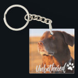 Unbothered Golden Hour Dog – Premium Minimalist  Keychain<br><div class="desc">Capture the ultimate vibe of peace and serenity with our 'Unbothered' Dog T-shirt design. Featuring a soulful Labrador/Retriever soaking up the golden hour sun with eyes closed, this design perfectly embodies the feeling of switching off from the world. Written in a trendy, handcrafted script, the word 'Unbothered' adds a modern,...</div>