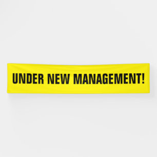 Under new management black yellow banner sign