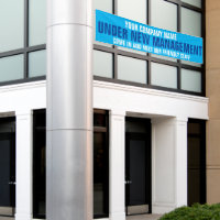 Under new management business signage blue