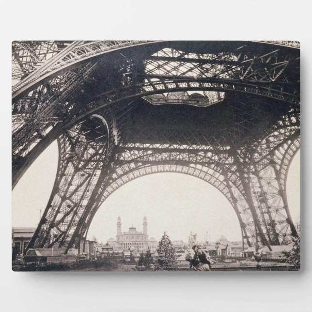 Under the Eiffel Tower, before ascending, from 'L' Plaque (Front)