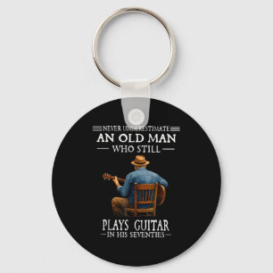Underestimate an old man who plays guitar seventie keychain