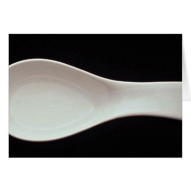 Une cuillère blanche en porcelaine (Devant horizontal)
