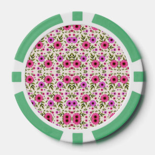 Une jeton de poker avec un motif floral en rose 