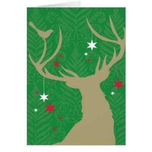 Une silhouette d'un cerf commun avec des étoiles