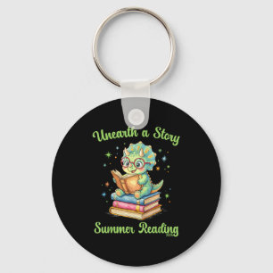 Unearth a story triceratops dinosaur reading books keychain