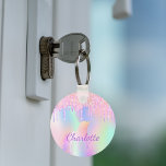 Unicorn glitter rainbow monogram name holographic keychain<br><div class="desc">A trendy holographic background with unicorn and rainbow pastel colours in pink,  purple,  rose gold,  mint green. Decorated with faux glitter drips in rose gold,  pink and purple. Personalize and add your name.  Purple coloured letters.  A bit of everyday glam to brighten up your day!</div>