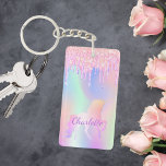 Unicorn pink glitter drips name holographic keychain<br><div class="desc">A trendy holographic background with unicorn and pastel colours in pink,  purple,  mint green. Decorated with faux glitter drips,  paint dripping look. Personalize and add your name.  Purple coloured letters.  A bit of everyday glam to brighten up your day!</div>