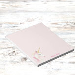 Unicorn pink name girl notepad<br><div class="desc">A cute pink and golden unicorn head. A soft, blush pink background. Personalize and add your name. Pink letters.</div>