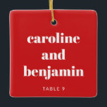 Unique Custom Place Card Christmas Wedding Red Ceramic Ornament<br><div class="desc">Make your winter wedding extra special with this unique custom ceramic ornament in red and white, doubling as a personalized place card for your guests. Featuring their name in elegant typography, it serves as a thoughtful escort card and a keepsake they can treasure. Perfect for a Christmas wedding, this festive...</div>