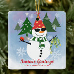 Unique Modern Funny Snowman Snowflakes Christmas Ceramic Ornament<br><div class="desc">Hang a little humour on your tree with this ceramic ornament featuring the snowman in full party mode. His red Santa hat with yellow polka dots, black sunglasses, and green scarf make him a standout among traditional decor. The editable text “Season’s Greetings And A Happy New Year” adds a personal...</div>