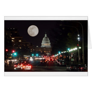 US Capitol Building at night with full moon