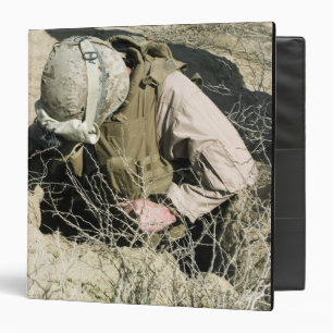 US Marine jumps down a hole Binder
