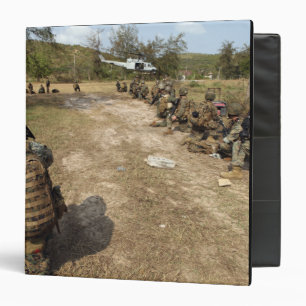 US Marines provide security as a UH-1N Binder