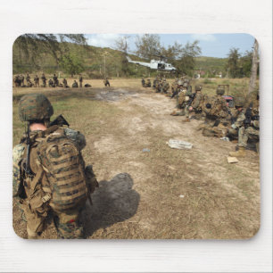 US Marines provide security as a UH-1N Mouse Pad