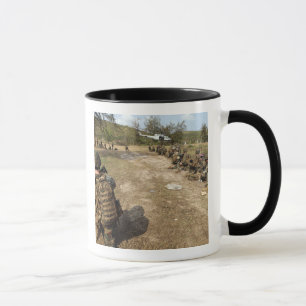 US Marines provide security as a UH-1N Mug