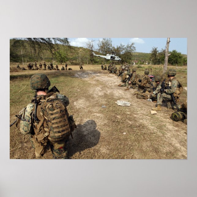 US Marines provide security as a UH-1N Poster (Front)