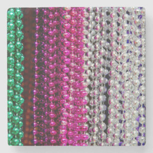USA, Louisiana, New Orleans. Mardi Gras Beads Stone Coaster