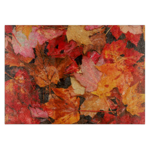 USA, Maine. Autumn maple leaves Cutting Board