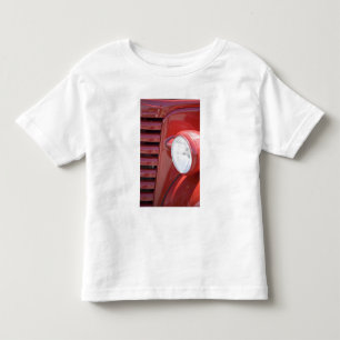 USA, Maine, Owl's Head. Headlight and partial Toddler T-shirt