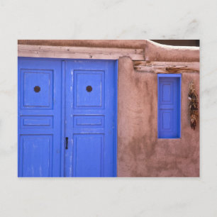 USA, New Mexico, Santa Fe. View of blue door and Postcard