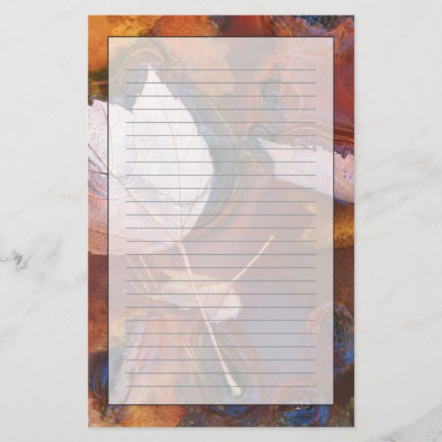 USA, Northeast, Fall leaves in puddle with Stationery (Front)