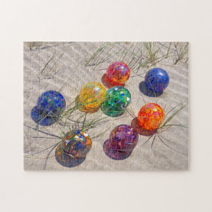 USA, Oregon. Colourful Glass Floats On Sand Dune Jigsaw Puzzle