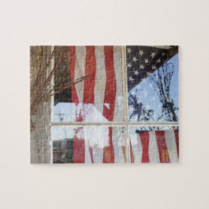 USA, Oregon, Shaniko. Flag in window next to Jigsaw Puzzle