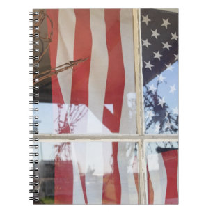 USA, Oregon, Shaniko. Flag in window next to Notebook