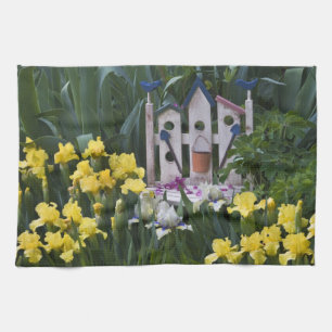 USA, Pennsylvania. Garden irises grow around Kitchen Towel