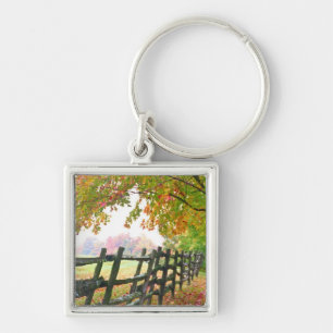 USA, Vermont. Fence under fall foliage. Keychain